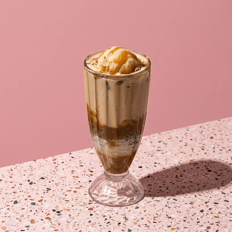 Salted Sunset Falooda โ rich butterscotch, salted caramel crunch, and double cream layers. Pure bliss.