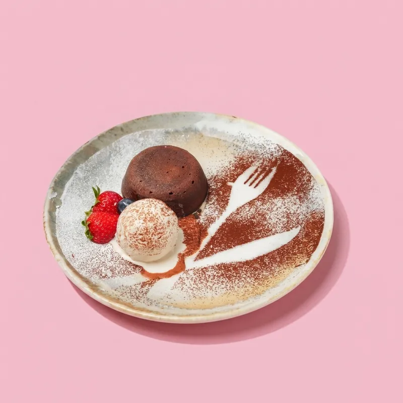 Freshly baked Molten Lava Cake with cascading Belgian chocolate & artisanal vanilla bean gelato. ๐ซ๐ฅ
